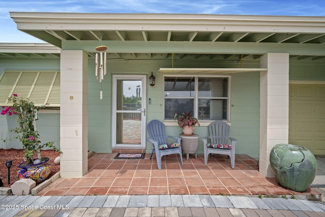 1030 S Orlando Ave, Cocoa Beach, FL 32931 - doorway to property featuring a porch