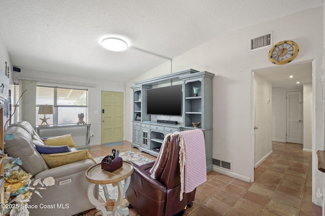 1030 S Orlando Ave, Cocoa Beach, FL 32931 - living area with vaulted ceiling and a textured ceiling