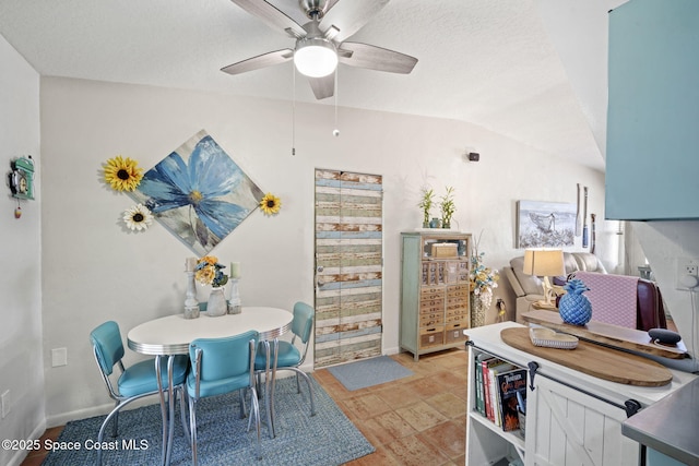 1030 S Orlando Ave, Cocoa Beach, FL 32931 - dining area featuring ceiling fan, lofted ceiling, and a textured ceiling
