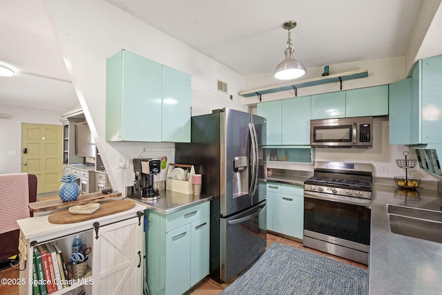 1030 S Orlando Ave, Cocoa Beach, FL 32931 - kitchen with stainless steel counters, stainless steel appliances, and decorative light fixtures