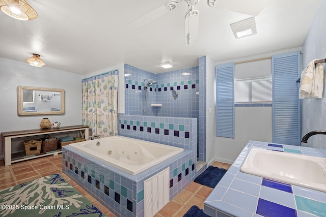 1030 S Orlando Ave, Cocoa Beach, FL 32931 - full bathroom with tile patterned floors, a tub with jets, tiled shower, and a ceiling fan