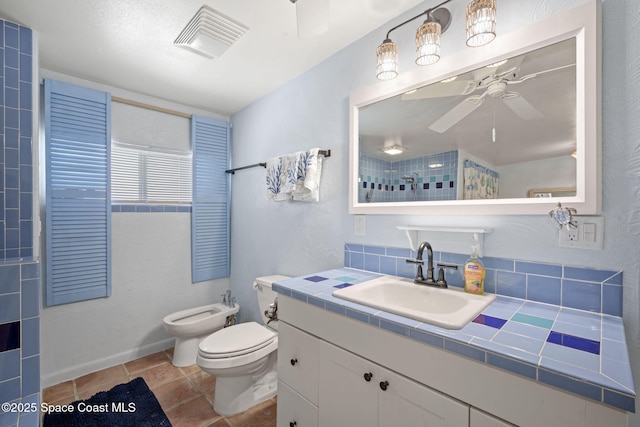 1030 S Orlando Ave, Cocoa Beach, FL 32931 - full bath with a ceiling fan, a bidet, vanity, a tile shower, and tile patterned floors