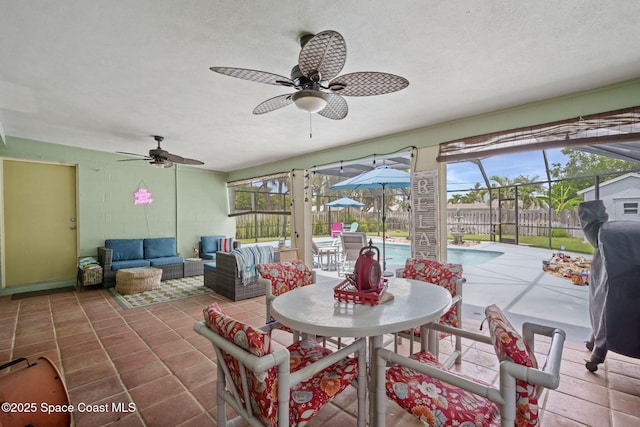 1030 S Orlando Ave, Cocoa Beach, FL 32931 - sunroom with a ceiling fan, an outdoor hangout area, and plenty of natural light