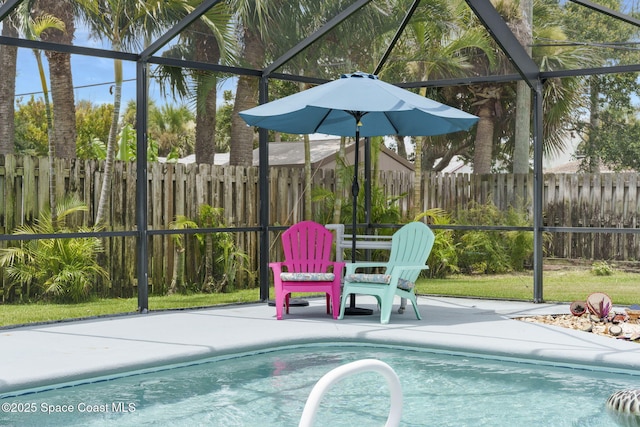 1030 S Orlando Ave, Cocoa Beach, FL 32931 - view of pool with a patio area, a fenced backyard, and a lanai