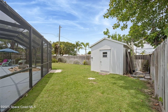 1030 S Orlando Ave, Cocoa Beach, FL 32931 - fenced backyard featuring a storage unit, a patio area, and a lanai