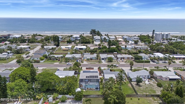 1030 S Orlando Ave, Cocoa Beach, FL 32931 - aerial view of property and surrounding area with a large body of water and nearby suburban area