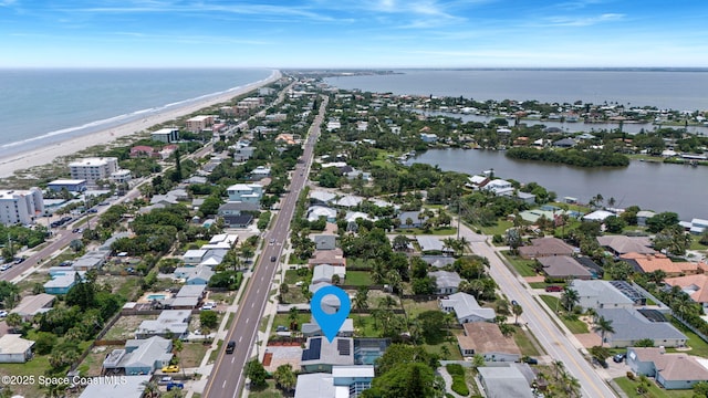 1030 S Orlando Ave, Cocoa Beach, FL 32931 - aerial view of property and surrounding area with waterfront with a beach and nearby suburban area