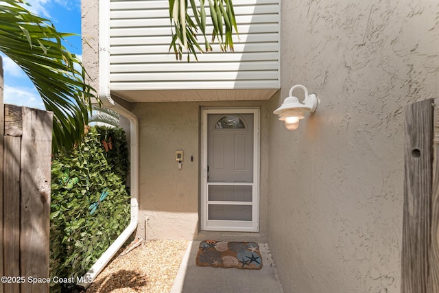 1710 Atlantic St Unit 5E, Melbourne Beach, FL 32951 - doorway to property with stucco siding