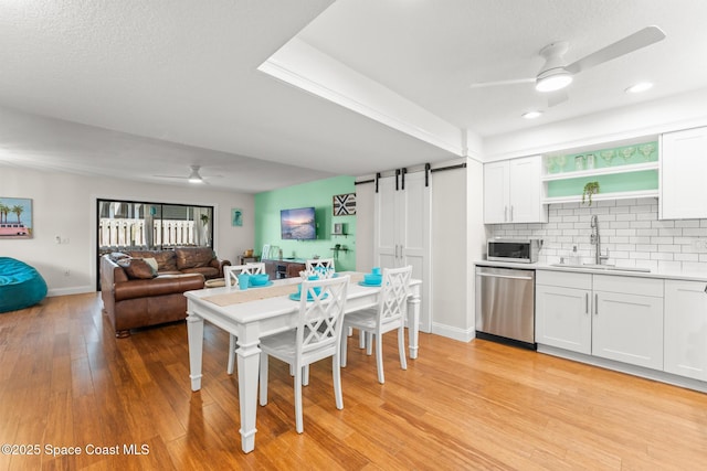 1710 Atlantic St Unit 5E, Melbourne Beach, FL 32951 - dining room with ceiling fan, light wood-type flooring, healthy amount of natural light, and recessed lighting
