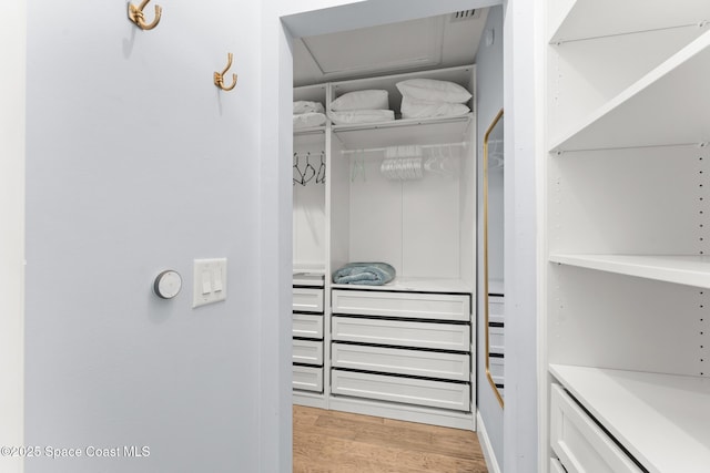 1710 Atlantic St Unit 5E, Melbourne Beach, FL 32951 - walk in closet featuring light wood-type flooring