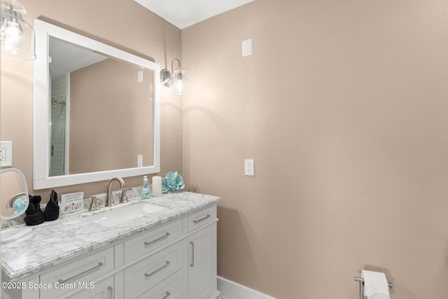 1710 Atlantic St Unit 5E, Melbourne Beach, FL 32951 - bathroom with vanity and baseboards