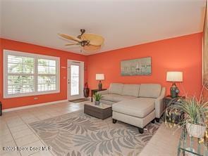 55 Woodland Dr Unit 206, Vero Beach, FL 32962 - living area featuring a ceiling fan and tile patterned flooring