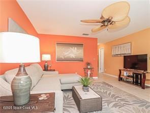 55 Woodland Dr Unit 206, Vero Beach, FL 32962 - living room featuring a ceiling fan and baseboards