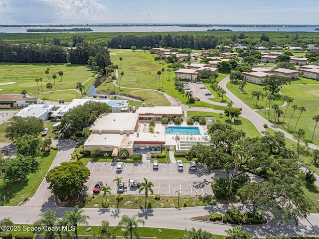 55 Woodland Dr Unit 206, Vero Beach, FL 32962 - aerial overview of property's location with a nearby body of water and a golf club