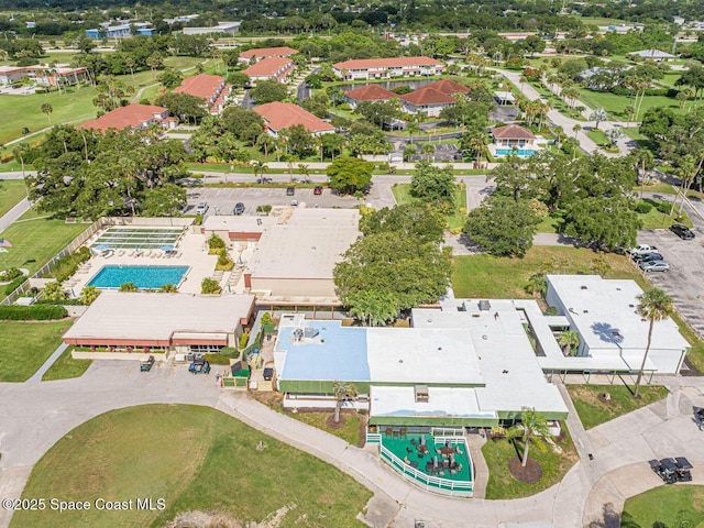 55 Woodland Dr Unit 206, Vero Beach, FL 32962 - aerial view of property and surrounding area with a pool area