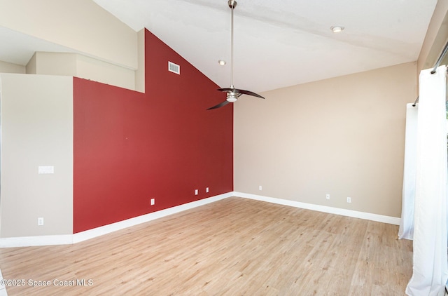 465 Apache Trl, Merritt Island, FL 32953 - spare room with light wood finished floors, ceiling fan, and high vaulted ceiling
