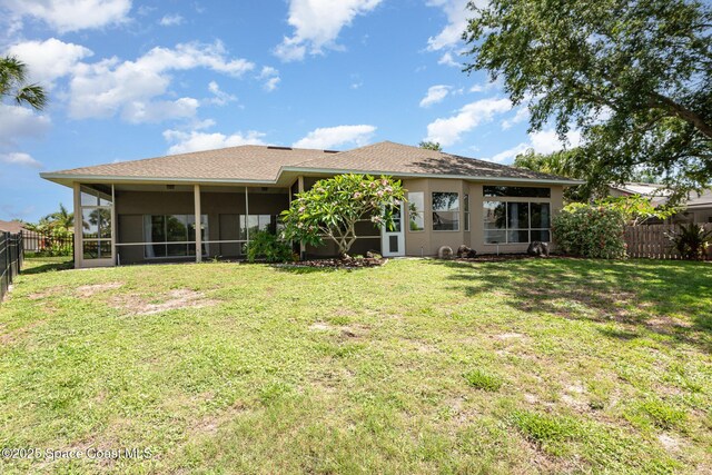 465 Apache Trl, Merritt Island, FL 32953 - rear view of property featuring a sunroom and stucco siding