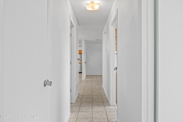 2812 Denison Ct, Cocoa, FL 32926 - corridor with a textured ceiling and light tile patterned floors