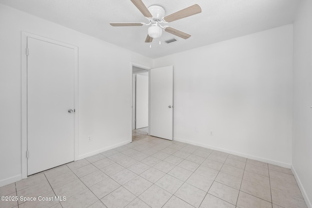 2812 Denison Ct, Cocoa, FL 32926 - empty room with ceiling fan and light tile patterned flooring