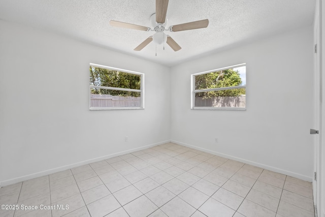 2812 Denison Ct, Cocoa, FL 32926 - spare room featuring plenty of natural light, a textured ceiling, a ceiling fan, and light tile patterned floors
