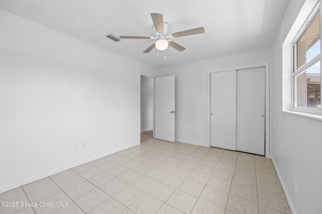 2812 Denison Ct, Cocoa, FL 32926 - unfurnished bedroom featuring a closet, light tile patterned floors, and ceiling fan