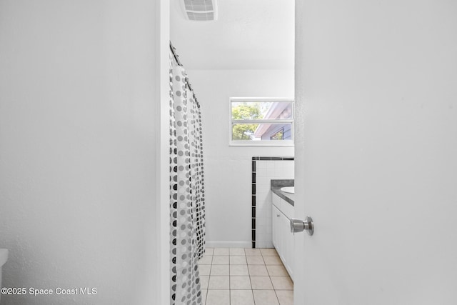 2812 Denison Ct, Cocoa, FL 32926 - bathroom with vanity, tile patterned floors, and a shower with curtain