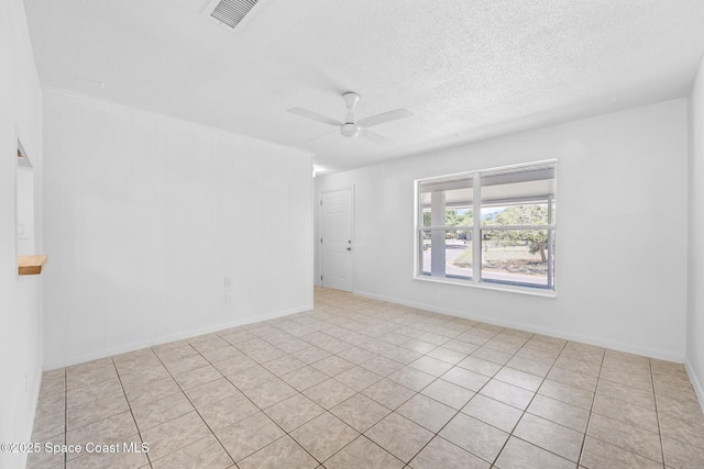 2812 Denison Ct, Cocoa, FL 32926 - unfurnished room with ceiling fan, a textured ceiling, and light tile patterned flooring