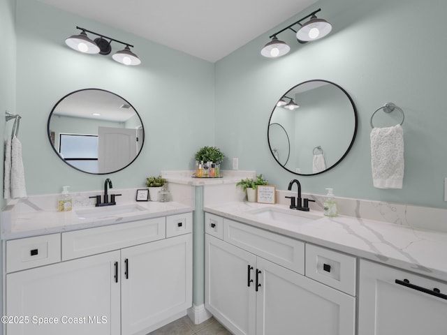 3662 Brantley Cir, Rockledge, FL 32955 - bathroom featuring two vanities and tile patterned flooring
