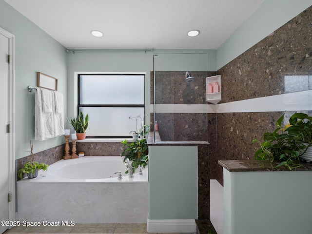 3662 Brantley Cir, Rockledge, FL 32955 - bathroom featuring a garden tub, walk in shower, and recessed lighting