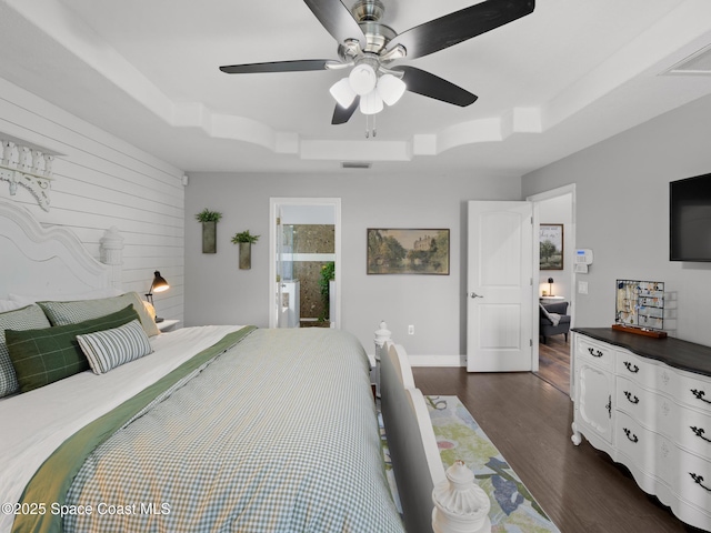 3662 Brantley Cir, Rockledge, FL 32955 - bedroom featuring a raised ceiling, dark wood-style flooring, and ceiling fan