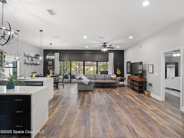 3662 Brantley Cir, Rockledge, FL 32955 - living room featuring a chandelier, ceiling fan, recessed lighting, and healthy amount of natural light