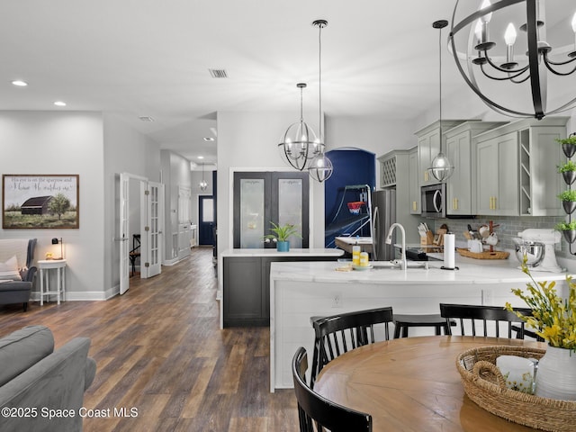 3662 Brantley Cir, Rockledge, FL 32955 - dining space featuring a chandelier, dark wood finished floors, and recessed lighting