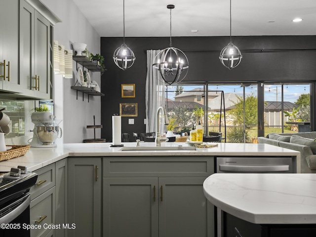 3662 Brantley Cir, Rockledge, FL 32955 - kitchen featuring gray cabinetry, light stone countertops, and hanging light fixtures