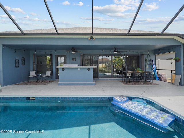 3662 Brantley Cir, Rockledge, FL 32955 - outdoor pool featuring a patio area, ceiling fan, a jacuzzi, and glass enclosure