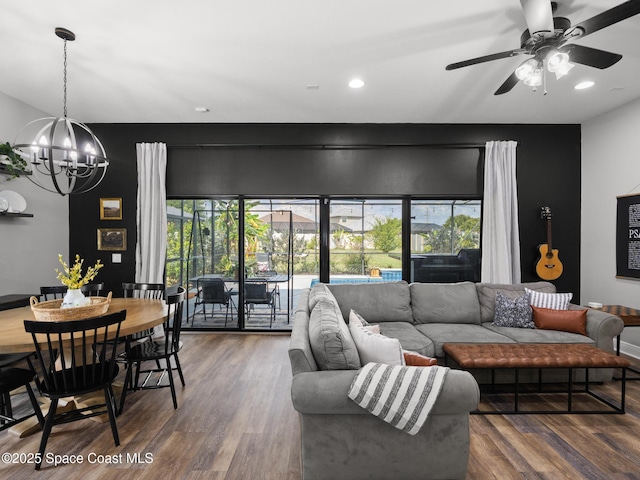 3662 Brantley Cir, Rockledge, FL 32955 - living room featuring a chandelier, wood finished floors, a ceiling fan, and recessed lighting