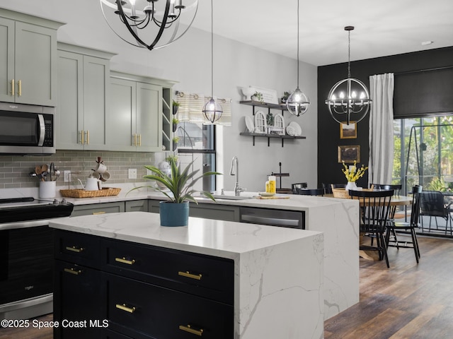3662 Brantley Cir, Rockledge, FL 32955 - kitchen with open shelves, a chandelier, appliances with stainless steel finishes, tasteful backsplash, and a center island