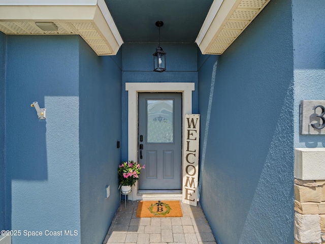 3662 Brantley Cir, Rockledge, FL 32955 - view of exterior entry featuring stucco siding