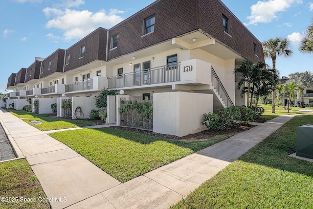 170 Paradise Blvd # 17, Indialantic, FL 32903 - view of property with a residential view and stairs