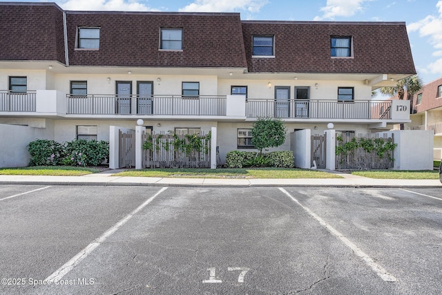 170 Paradise Blvd # 17, Indialantic, FL 32903 - view of building exterior featuring uncovered parking