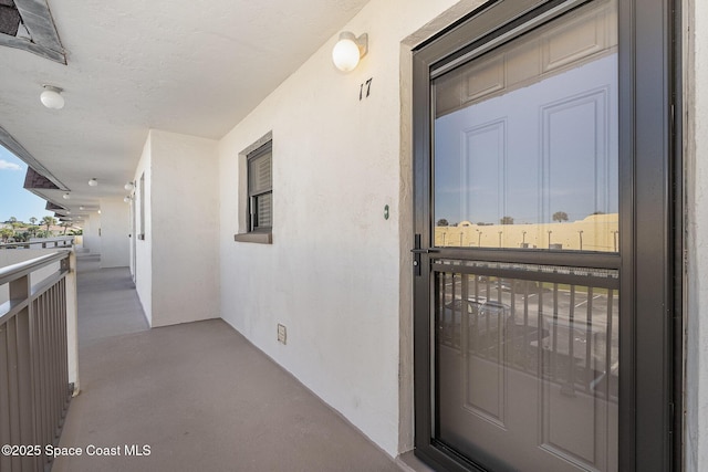 170 Paradise Blvd # 17, Indialantic, FL 32903 - view of exterior entry featuring stucco siding and a balcony