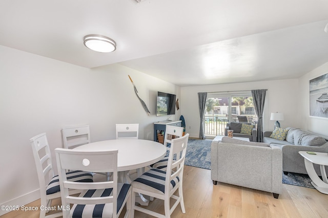 170 Paradise Blvd # 17, Indialantic, FL 32903 - dining area featuring light wood-style flooring