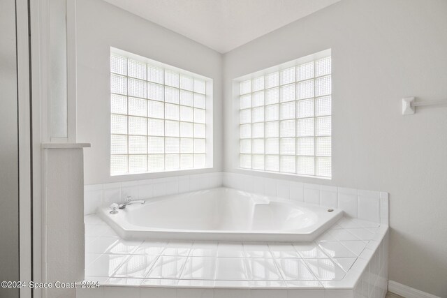 621 Misty Creek Dr, Melbourne, FL 32940 - full bathroom featuring plenty of natural light and a garden tub