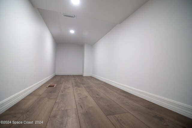 621 Misty Creek Dr, Melbourne, FL 32940 - corridor with lofted ceiling, hardwood / wood-style flooring, and recessed lighting