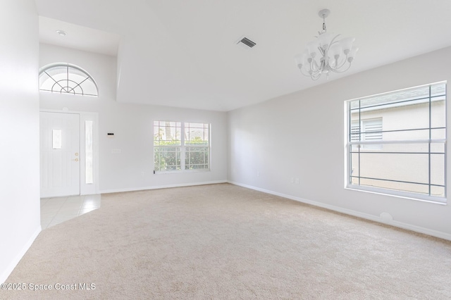 621 Misty Creek Dr, Melbourne, FL 32940 - unfurnished living room with carpet and a chandelier