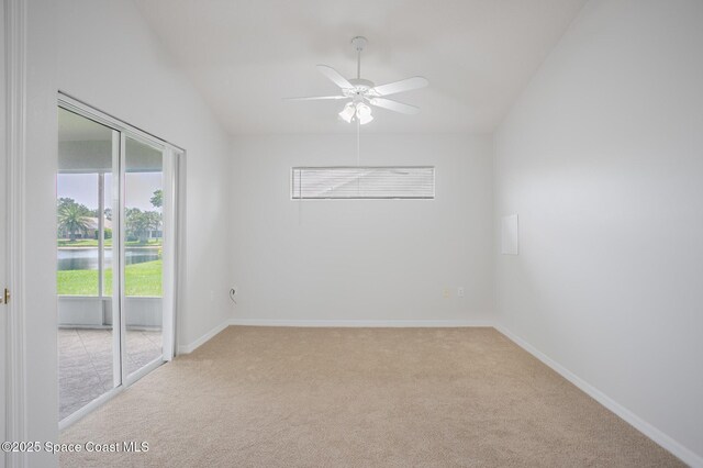 621 Misty Creek Dr, Melbourne, FL 32940 - unfurnished room with light colored carpet, ceiling fan, a water view, and vaulted ceiling