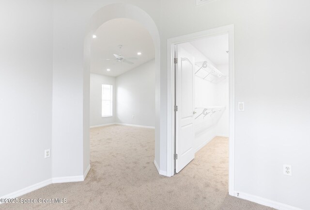 621 Misty Creek Dr, Melbourne, FL 32940 - hallway featuring carpet, arched walkways, and recessed lighting