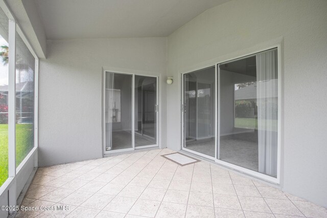 621 Misty Creek Dr, Melbourne, FL 32940 - unfurnished sunroom featuring vaulted ceiling