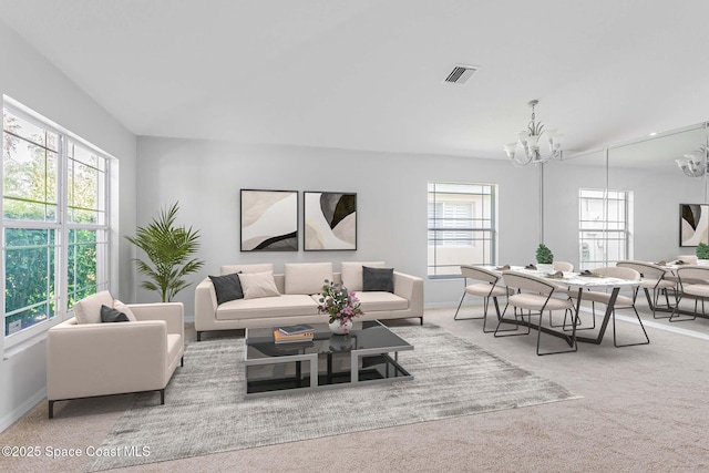 621 Misty Creek Dr, Melbourne, FL 32940 - carpeted living room featuring a chandelier and baseboards