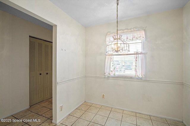 1289 Cheney Hwy Unit B, Titusville, FL 32780 - unfurnished dining area featuring a chandelier and tile patterned floors