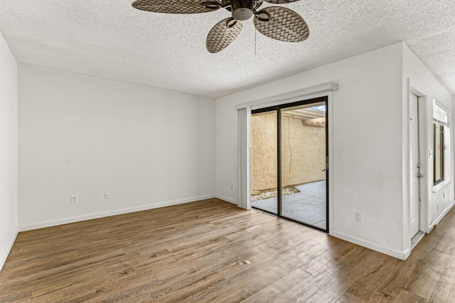 1441 Sheafe Ave NE Unit 104, Palm Bay, FL 32905 - spare room featuring wood finished floors, a textured ceiling, and ceiling fan